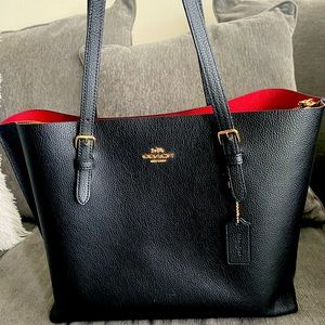Black Coach Tote w/ red inside.